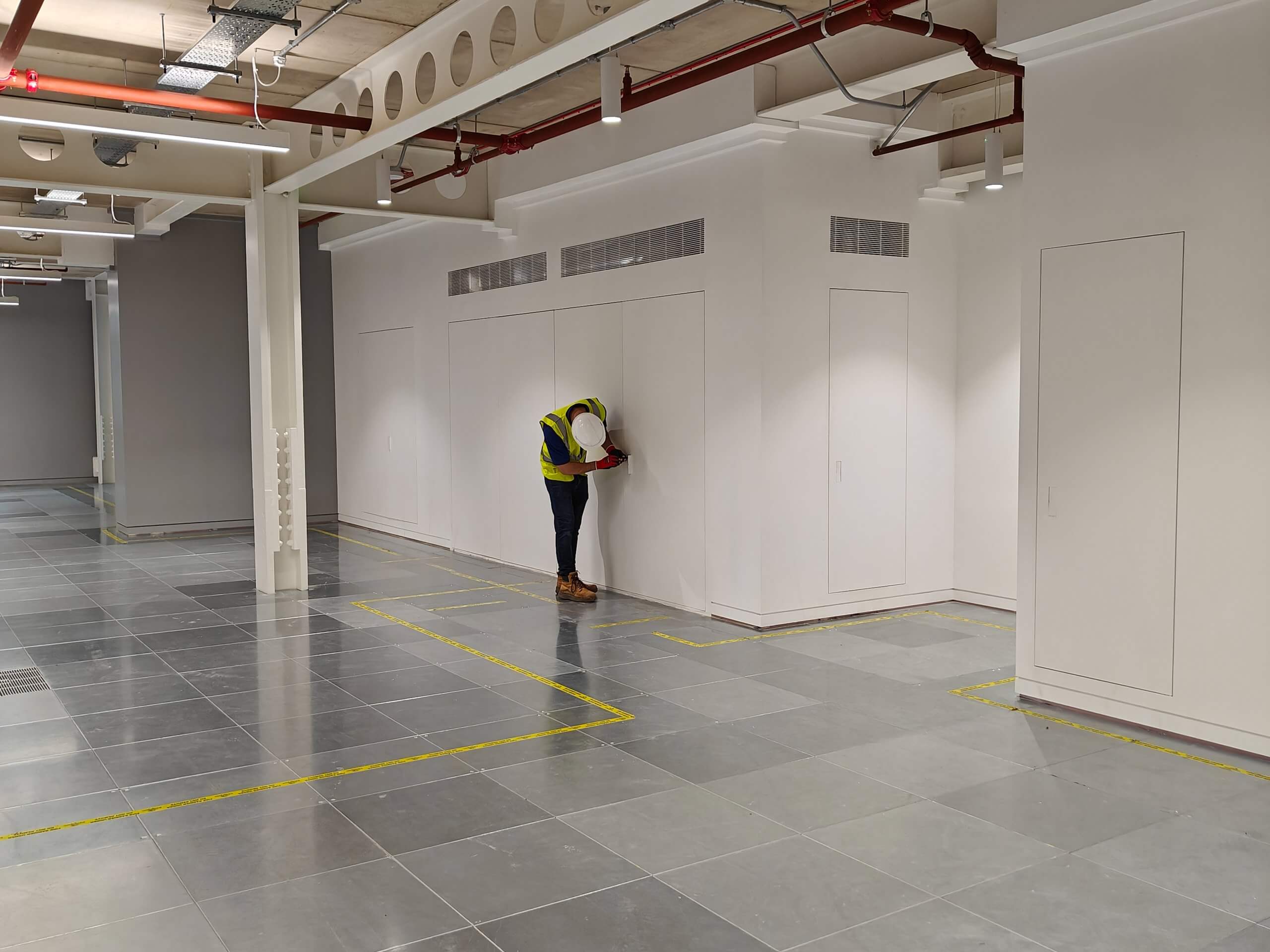 Christo riser doors installed in a modern commercial hallway